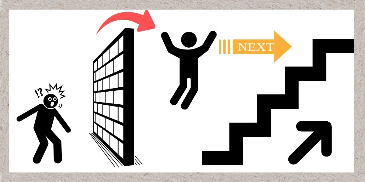 壁にぶつかってそれを乗り越えるイメージイラスト